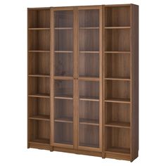 a wooden bookcase with glass doors on the front and bottom shelves in various sizes