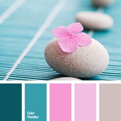 the color scheme is blue, pink and grey with white rocks on top of it