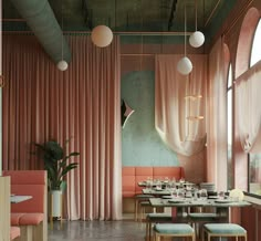 the interior of a restaurant with pink curtains and tables set up for dinner or lunch