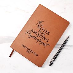 a note book with writing on it next to a pen