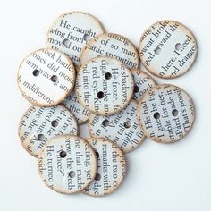 six wooden buttons with words printed on them