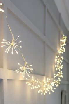 a string of lights hanging from the side of a wall