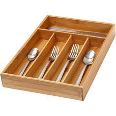 a wooden tray with utensils and spoons in it