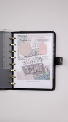 an open planner book with various items inside