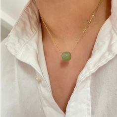 Tap into the spiritual properties of Nephrite Jade with our Ariana pendant necklace. This beautiful stone is known for promoting balance and inner peace, while also providing protection against negative energy and attracting love and money. Embrace abundance and harmony with this valuable jade pendant. 16 inches long + 2 inches ext 18K PVD gold plated stainless steel Nephrite Jade Non Tarnish And Water Resistant Inner Peace, Protection Against Negative Energy, Attracting Love, Jade Pendant Necklace, Nephrite Jade, Jade Pendant, Negative Energy, Jade, Tap