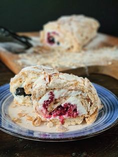 a plate that has some kind of pastry on it with berries and ice cream in the middle