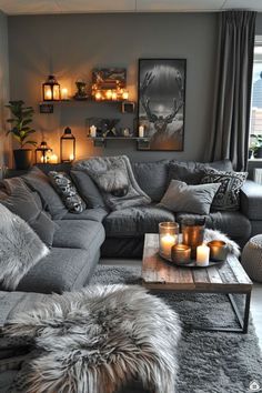 a living room filled with lots of furniture and candles on top of it's coffee table