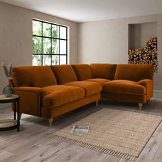 an orange sectional sofa in a living room