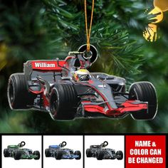 an ornament shaped like a racing car hanging from a christmas tree