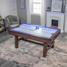 a living room with a coffee table that has an ice hockey game on top of it