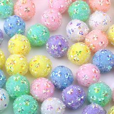 many different colored balls with glitter on them