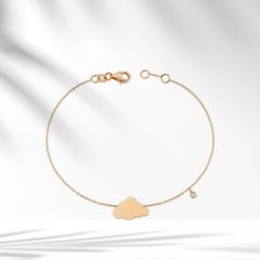 ☁︎8k/14k/18k Solid Gold Cloud Charm Bracelet with Dangle Diamond, Minimalist Gold Cloud Bracelet, Bazel Setting Dainty Valentines Day gift☁︎      Description: ☁️Embrace the delicate beauty of our 8k/14k/18k Solid Gold Cloud Diamond Bracelet. A tiny, dainty masterpiece that adds a touch of enchantment to your style.☁️ 💎 Featuring a certified diamond, our Cloud Bracelet is a symbol of elegance and grace. 💎 Details of the Product: Weight: Approximately 1.55g Diamonds: 0.02ct Color: F Clarity: SI Piece: 1 Cut: Round ☁️ Never lose hope. The darkest clouds procede the loveliest rain.-Avijeet Das. ☁️ Our Cloud Bracelet is more than jewelry; it's a fashionable statement that enhances your look with a touch of charm. Every piece is handmade with precision, crafted from genuine 8K, 14K, or 18K rea Cloud Jewelry, Cloud Bracelet, Gold Armband, Delicate Beauty, Fancy Jewelry, Selling Jewelry, Real Gold, Diamond Bracelet, Valentine Day Gifts