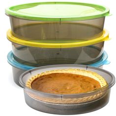 there are three pie pans stacked on top of each other and one has a pie in it