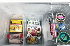 an open refrigerator door with food in it and other items inside the freezer compartment