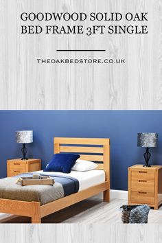 a bed frame is shown with blue walls and wood furniture in the background text reads, goodwood solid oak bed frame 3ft single