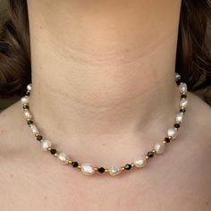 "Black sparkly genuine cultured freshwater Pearl necklace with gold accents Every necklace comes with a 2\" extension chain  Photo reference is worn at 16\" Clasp is stainless steel and gold plated PACKAGING  They will come in a little organza gift bag so make the perfect present!  CARE OF ITEM Avoid contact with water/liquids as this may cause tarnishing Store away from sunlight Handmade necklace beaded custom necklace custom bracelet custom anklet custom jewellery birthday gift Christmas gift anniversary gift cute gift name necklace word necklaces" Black Handmade Necklace, Black Pearl Choker As A Gift, Black Pearl Choker Gift, Black Pearl Choker As Gift, Pearl Necklace With Gold, Pearl Necklace Handmade, Genuine Pearl Necklace, Black Freshwater Pearls, Black Beads Mangalsutra