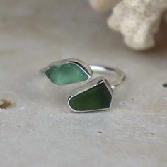 This ring is entirely handcrafted by me in my home studio in Wales The sea glass was hand picked by myself on my local beach, St Mary's Well Bay, Penarth. The sea glass has been set in sterling silver bezels. The ring is UK size R One ring included in price. ------Instructions------ For a longer and better quality life for your handmade silver item, please avoid contact with chemicals similar to perfume, detergents and soaps.  ------Postage------ Each item of jewellery is delivered in a customised Searosejewellery jewellery box. If you order one item, it will be delivered in a sturdy envelope. If you order two or more, your items will be delivered in a sturdy customised cardboard box. All packaging is eco friendly and recyclable.  ------International shipping------ I ship all items as stan Sea Glass Ring, Ring Wire, Bold Rings, Recycled Jewelry, Statement Ring Silver, Glass Rings, One Ring, Jewelry Inspo, Cardboard Box