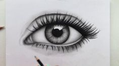 a drawing of an eye with long lashes