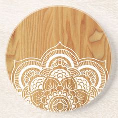 a wooden plate with an intricate design on it