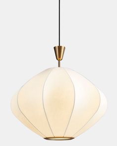 a white and gold pendant light hanging from a ceiling