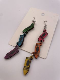 Adorable dangly wood earrings with multi-colored crayons! perfect gift for a teacher or art lover! Crayon Earrings, Tennessee Fashion, Gift For A Teacher, University Of Tennessee, Premier Designs, Teacher Tshirts, Wood Earrings, Art Gift, Multi Colored