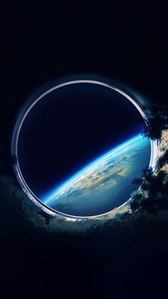 an image of the earth seen through a hole in the sky with clouds and stars