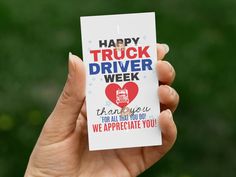 a person holding up a card with the words happy truck driver week on it