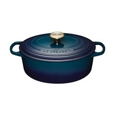 le creuset cast iron casserole with lid in blue, on a white background