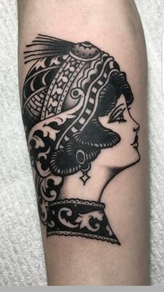 a woman's head with an ornate design on her arm