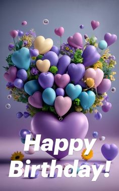 a vase filled with lots of hearts and flowers on top of a purple tablecloth