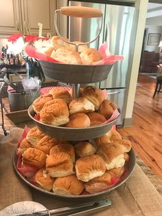 three tiered trays filled with pastries on top of a table