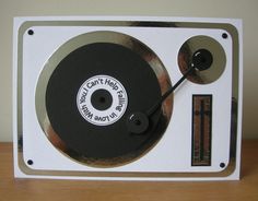 an old fashioned record player on a wooden table