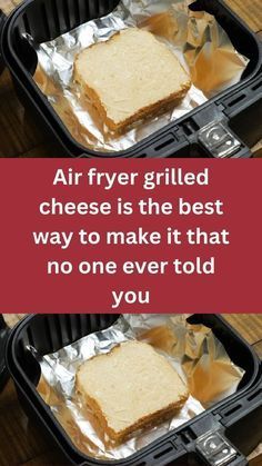 two pieces of bread sitting in a plastic container on top of a wooden table next to a red sign that says, air fryer grilled cheese is the best way to make it that no one ever told you