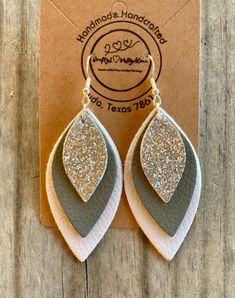 "NEW - White, Grey & Silver Leaf Dangle Faux Leather Lightweight Earrings | Beautiful Handmade Earrings | PU Faux Leather | Regular-Solid Size Earrings | Each Piece is Double-Sided  - Measurements: Length \"2.75\" inch  Drop \"2.25\" inch  Width \"1.10\" inch  - *All Handmade and Handcrafted Earrings are faux leather and are made with hypoallergenic hooks for sensitive ears & Nickel-Free * *925 Sterling Silver Hypoallergenic Hooks" Diy Earrings Leather Ideas, Scrap Leather Earrings, White Leather Earrings, Craft Fair Items To Make And Sell, Diy Leather Earrings Tutorials, Faux Leather Fall Earrings, How To Make Faux Leather Earrings, Leather Cricut Earrings, Making Leather Earrings