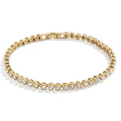 PRICES MAY VARY. Perfect For Stacking - This eternity-style Bracelet makes for an easy addition to your already-curated wrist stack. This gold and crystal band features a lineup of beautiful bezel stones and stacks perfectly with other bracelet styles. High Quality & Safe for Sensitive Skin - Made with hypoallergenic high quality, 18k gold-plated brass, our Amalie Tennis Bracelet is a durable, long-lasting piece of jewelry that is safe for sensitive skin, people with allergies, and won't turn yo Gold Crystal Tennis Bracelet For Anniversary, Gold Stackable Crystal Bracelet, Gold Stackable Crystal Bracelet For Everyday, Stackable Gold Crystal Bracelet For Everyday, Everyday Stackable Gold Crystal Bracelet, Cute Gold Bracelets, Enewton Bracelets Stacks, Bracelet Styles, Wrist Stack