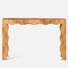 a wooden table with an intricate design on the top and bottom edge, against a white background