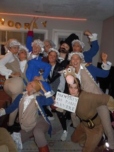 a group of people in costumes posing for a photo