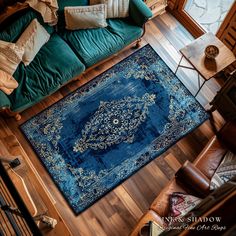 a large blue rug on the floor in a living room