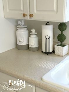 the kitchen counter is clean and ready to be used as a place for soap dispensers