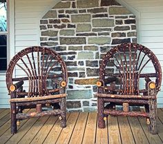 two wooden chairs sitting on top of a wooden floor