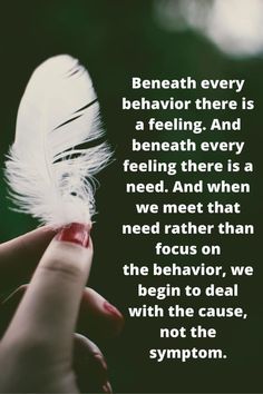 someone holding a feather in their hand with the caption beneath it that reads, beneath every behavior there is a feeling and