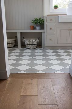 a white and gray checkered floor in a kitchen