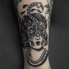 a woman's leg with a tattoo on it