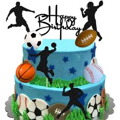 a birthday cake decorated with soccer, basketball and football players on the top tiers