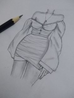 a pencil drawing of a dress on paper