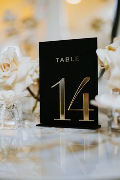 the table numbers are black and gold