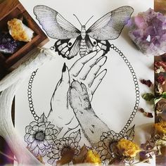 a drawing of two hands with a butterfly on it and flowers in front of them