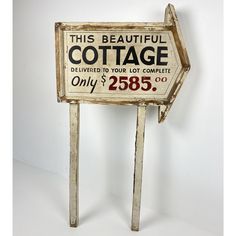 an old wooden sign advertising cottage on it's side with the words, this beautiful cottage delivered to your lot complete only $ 250 00