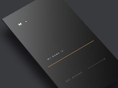 a black and gold business card on a dark background