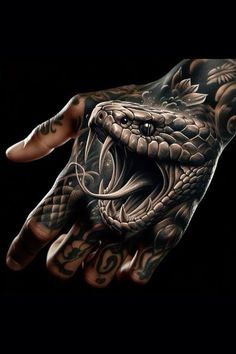 a man's hand with a tattoo on it that has a large snake in the middle